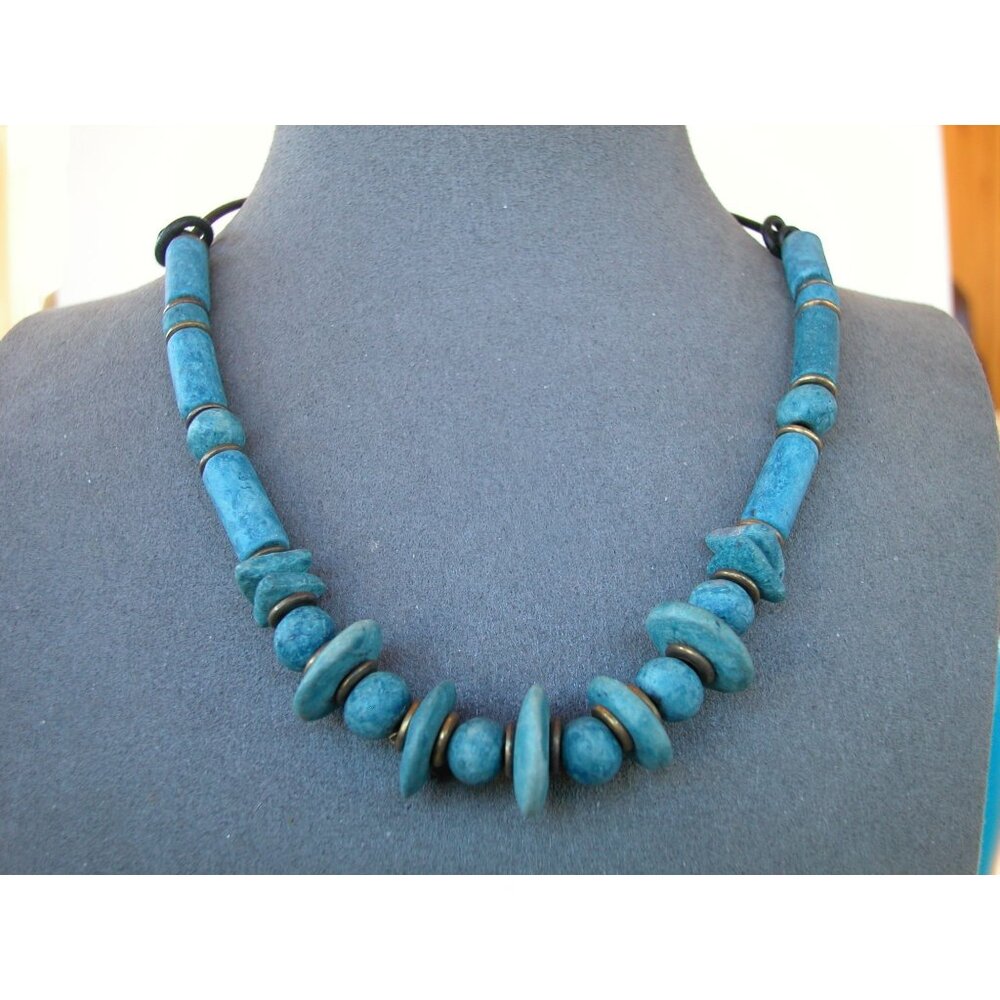 Necklace 16"  matte-finish blue beads and smaller brass-colored spacers.